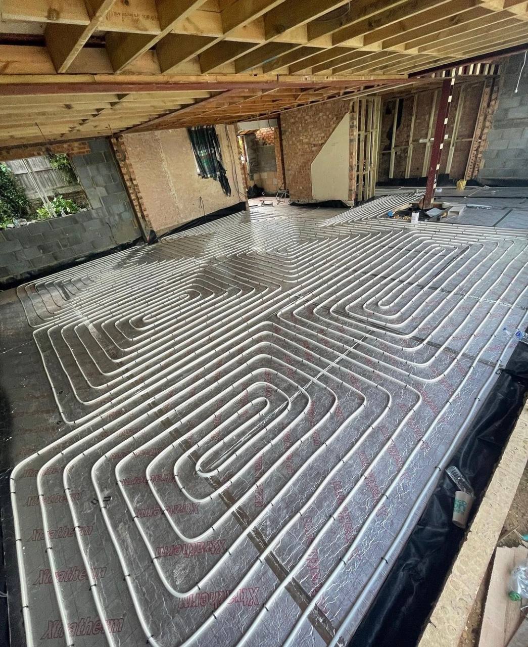 Wet underfloor heating installation in a North London extension