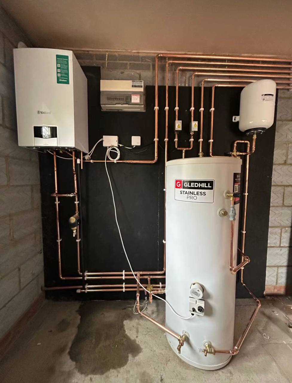 Central heating installation with pipework and cylinder in North London